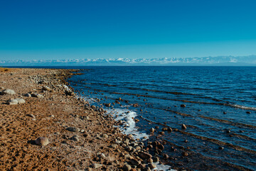 Beautiful lake shore of Issyk-kul lake in Kyrgyzstan in spring