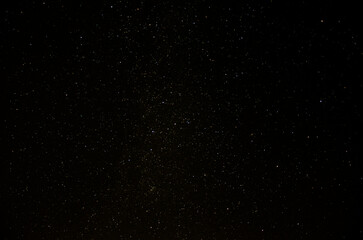 Night sky with stars and milky way. Space background. Long exposure photograph.