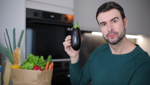 Man showing a healthy eggplant 