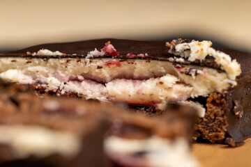 cottage cheese dessert with cherry jam covered with chocolate