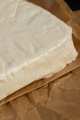 close-up of a piece of soft Caucasian cheese made from milk