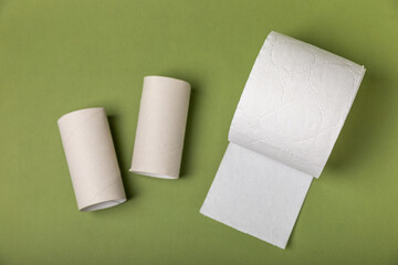 Empty toilet paper roll. Rolls of toilet paper on background. Paper tube of toilet paper. Place for...