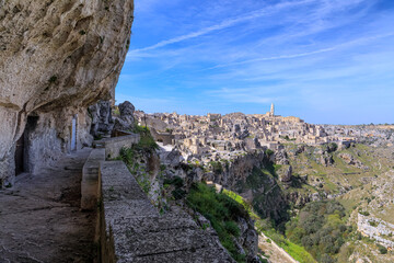 Skyline of the Sassi of Matera: view of the historic center and the ravine of Murgia Materana from an alley dug into the limestone.