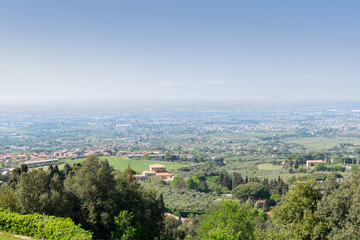Stunning view from the valley's overlook, revealing the outskirts of Rome on a sunny day against the backdrop of the distant horizon