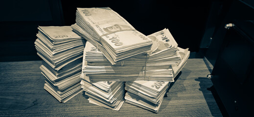 Bales of Turkish Lira banknotes in the bank in front of the cash register