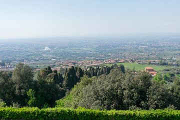 Breathtaking panoramic view of Rome's outskirts, seen from the valley's crest on a sunny day with the distant horizon