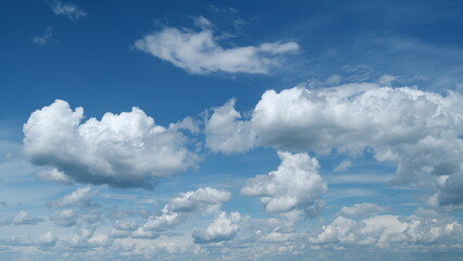 White cumulus and cirrus or cirrostratus cloudscape on beautiful sunny clear sky. Tropical summer...