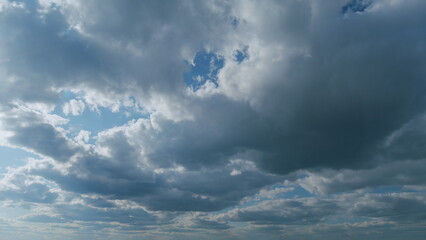 White and blue colors sky with stratus and stratocumulus clouds. Weather was very hot in the...