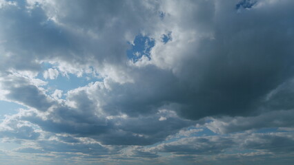 White and blue colors sky with stratus and stratocumulus clouds. Weather was very hot in the evening. Tropical summer sunlight. Timelapse.