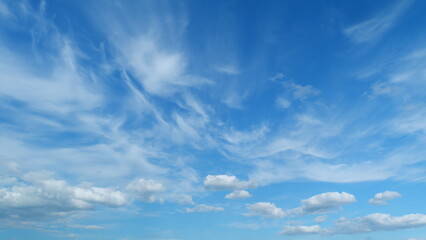 Tropical summer sunlight. Blue sky with cirrus clouds. Fluffy layered clouds sky atmosphere....