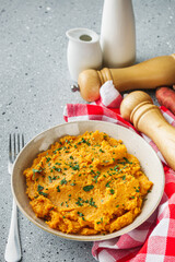 delicious mashed sweet potatoes on a light stone background