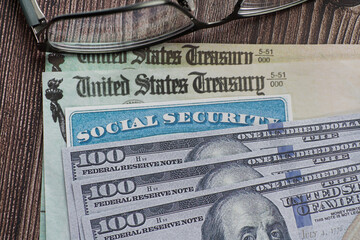 Fake Social security card on prop US currency and treasury department checks