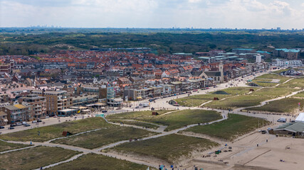 Aerial drone photo of the coastal town Katwijk with a beach and boulevard.