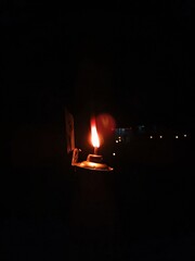 Burning oil lamp in the night