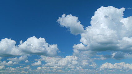Fluffy clouds sky atmosphere. Puffy fluffy white clouds. Cloud sky scape. Time lapse.