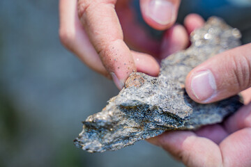 mining of precious stones by men's hands