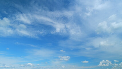 White and gray clouds fly across the sky and change shape. Clearing day and good windy weather....