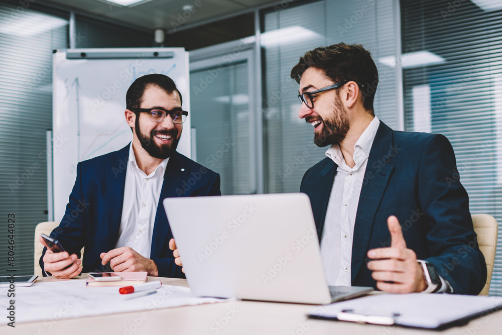 Poster two office workers in business meeting sitting at desk using computer for business training, profess