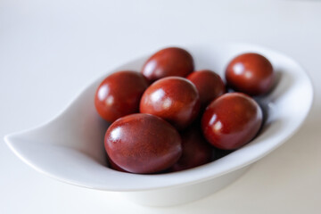 Chicken eggs painted red for Ester on white