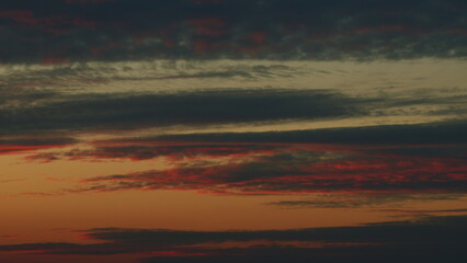 Fototapeta premium Summer sky at sunset with clouds. Cloudscape in tropical summer sunlight. Timelapse.