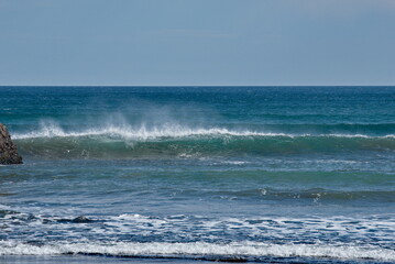 Russia. The Far East. The Kuril Islands. Storm waves coming towards the gusty wind from the shore of Iturup Island in the Sea of Okhotsk.