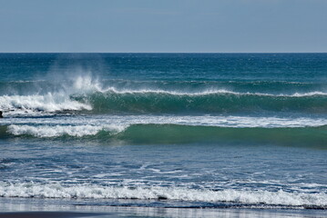 Russia. The Far East. The Kuril Islands. Storm waves coming towards the gusty wind from the shore...