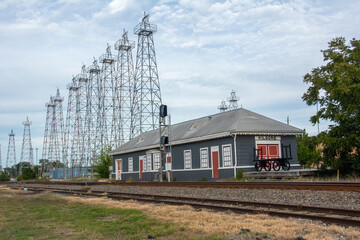 View of the Kilgore I and GN-Missouri Pacific Railroad Station with iron oil derricks in Gregg and Rusk counties, Texas, USA