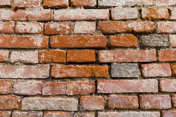 Aufnahme einer alten roten Backsteinziegelwand, als Hintergrundbild