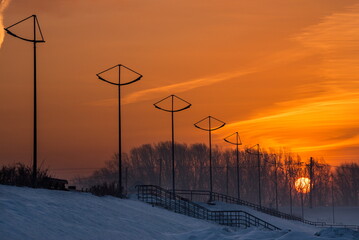 Novokuznetsk, Russia. The South of Western Siberia. The rising sun over the lanterns of the...