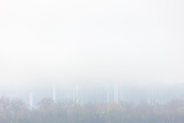 Tall modern buildings of downtown Toronto seen through the mist