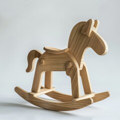Charming wooden rocking horse gracefully poised on a pristine white background
