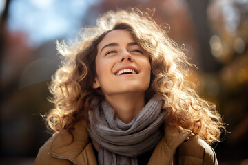 Portrait of beautiful young woman with closed eyes on sunny day outdoors