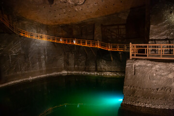 WIELICZKA, POLAND - JUNE 30: Underground staircase and Wieliczka salt cave lake
