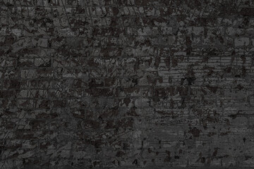 Texture of an old black brick wall. Abstract construction background.