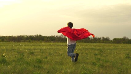 boy son child superhero game running park field sunset grass victory red cloak fancy dress, sunset...