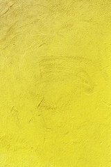 Texture of an old yellow plastered wall. Abstract construction background.