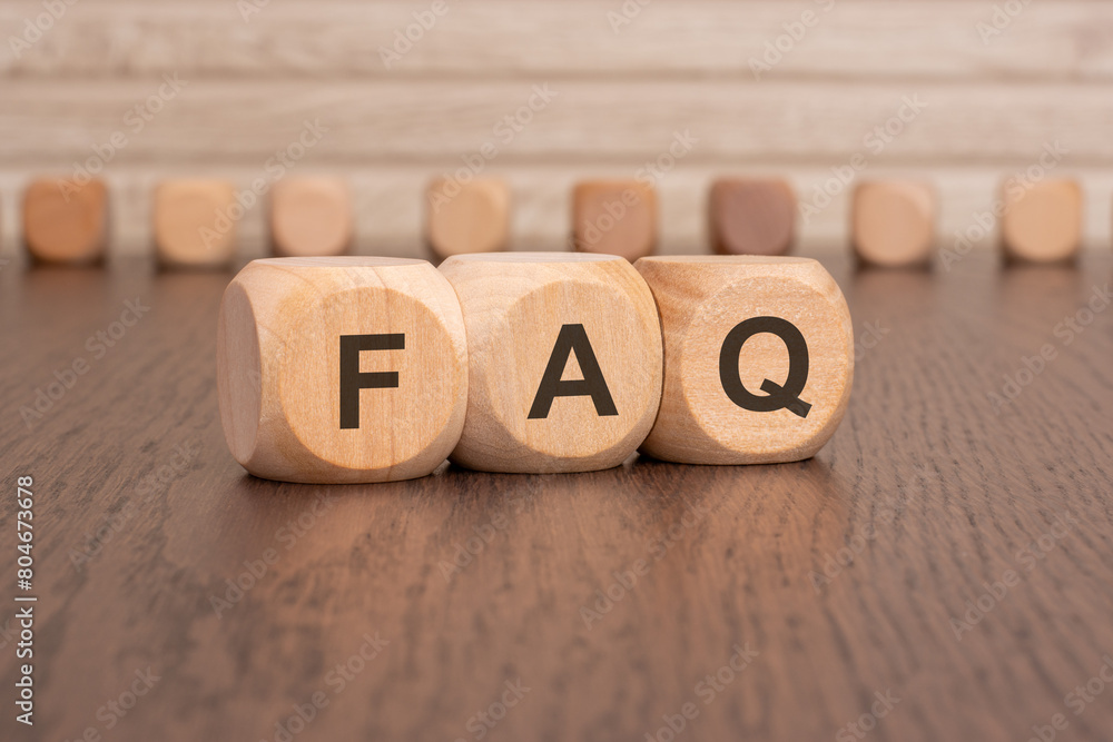 Poster wooden blocks with the letters faq on them