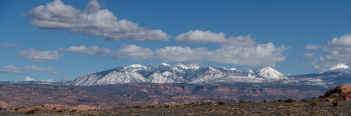 Panoramic Landscape views of La Sal Mountains on a Blue sky day in Spring