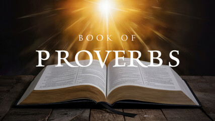 Open Book of Proverbs on a wooden table illuminated by bright light creating a mystical atmosphere