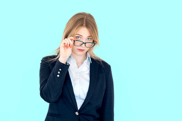 Attractive blonde businesswoman standing isolated on white background