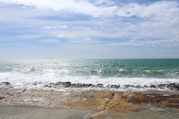 Fototapeta na wymiar waves on the seanatural background of sky, sea and rocks, Mediterranean coast in Spain,