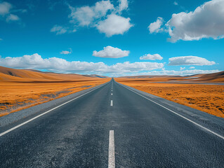 Fototapeta premium the road to the sky, a straight road leading into the distance, clear blue sky with clouds.