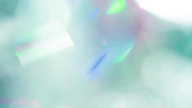 Vibrant Iridescent Optical Highlights. Loop. The light passes through the facets of a slowly rotating diamond and creates repetitive sparkling highlights and rainbow colors