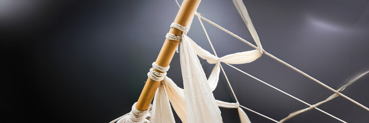 linen and bamboo structure design on a grey background