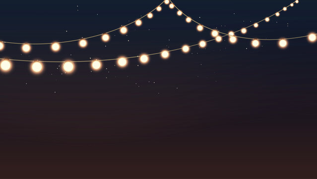 an outdoor garland with glow yellow lamps
