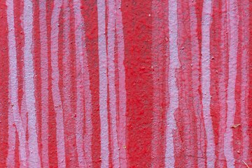 Absctract red coloured wall background. Close-up view of red painted textured concrete wall with...
