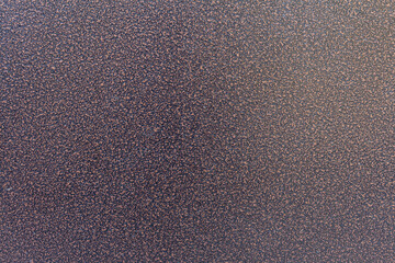 Close-up front view of black and brown textured metal apartment's door surface. Copy space for your text or decoration. Abstract background. Construction industry and materials theme.