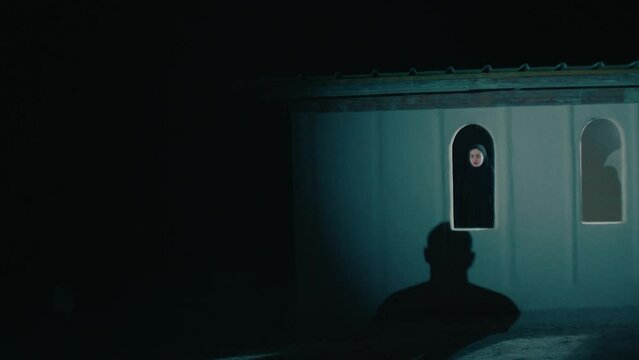 A woman in isolation at night