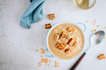 Vegan Yellow split pea soup puree with croutons