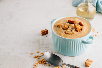 Vegan Yellow split pea soup puree with croutons